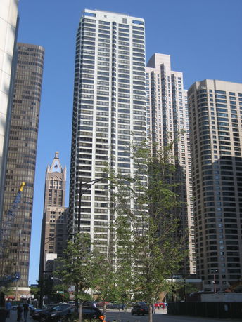 Front view of a high-rise building in a cityscape.
