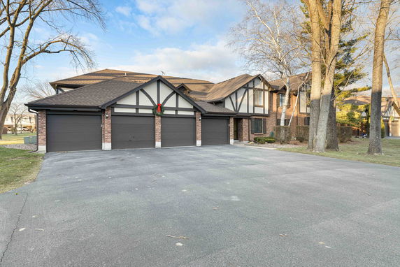Front view of a house with a multi-car garage.