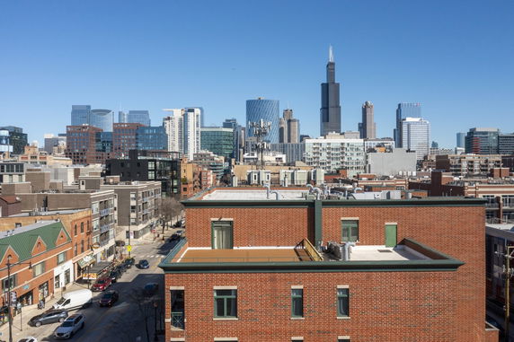 Panoramic view of a city skyline with various high-rise buildings.
