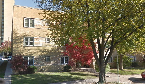 Front view of a multi-story brick building.