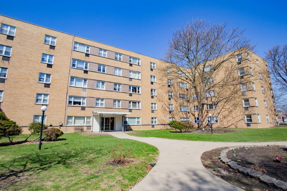 Front view of a multi-story apartment building.