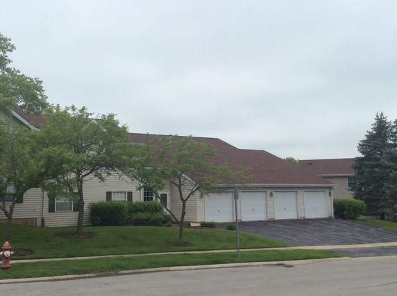 Front view of a house with a multi-car garage.