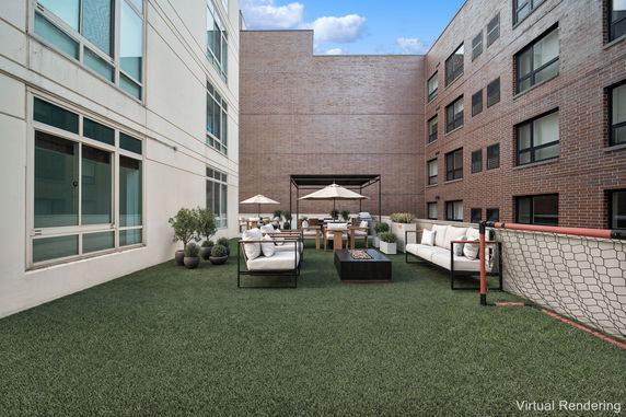 Rooftop with seating area and umbrellas.