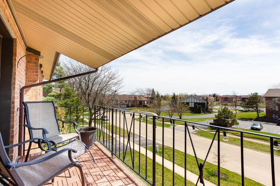 Panoramic view from a balcony showing a suburban neighborhood.