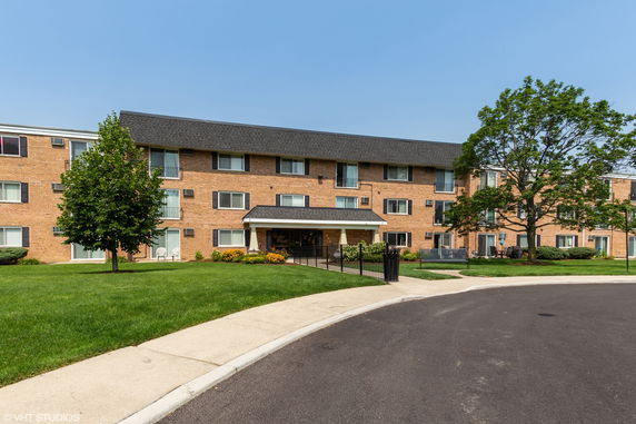 Front view of a multi-story apartment building.