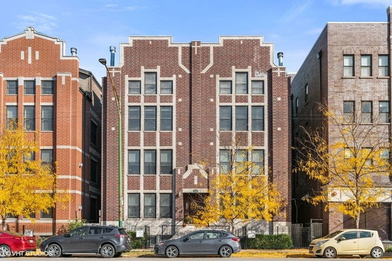 Front view of a multi-story brick residential building.
