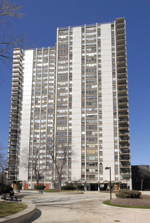 Front view of a tall multi-story residential building