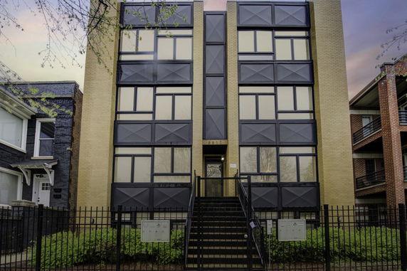 Front view of a multi-story building with modern design.
