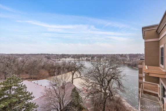 View overlooking a river and surrounding landscape from a building.