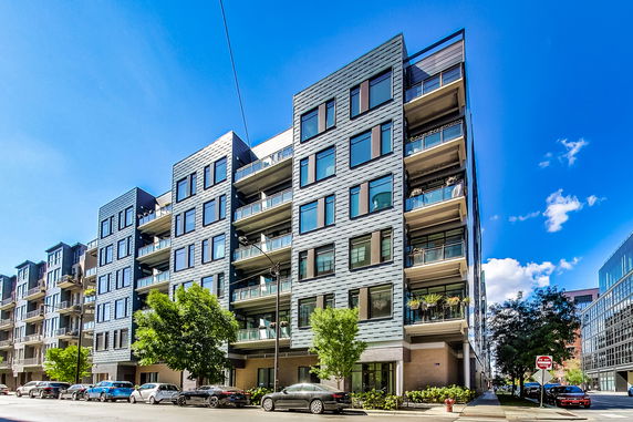 Front view of a modern multi-story apartment building.