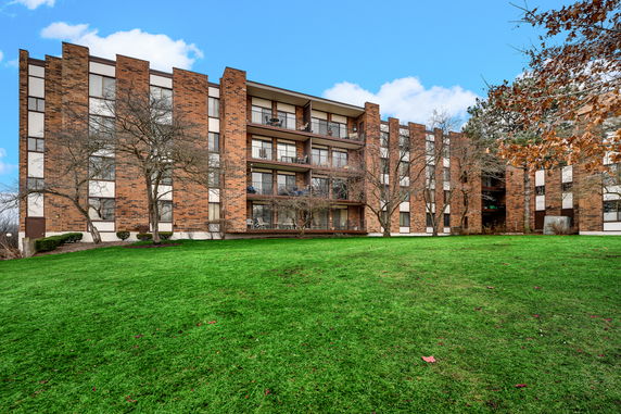 Front view of a multi-story brick apartment building
