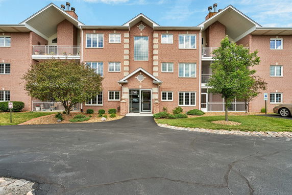 Front view of a multi-story brick apartment building