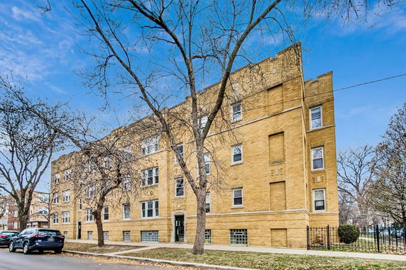 Front view of a multi-story brick building.
