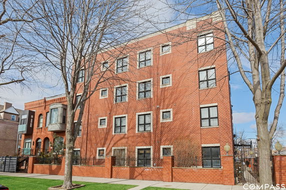 Front view of a multi-story brick building.
