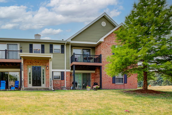 Front view of a two-story residential building with balconies.