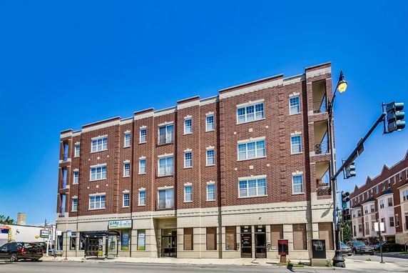 Front view of a multi-story brick building.
