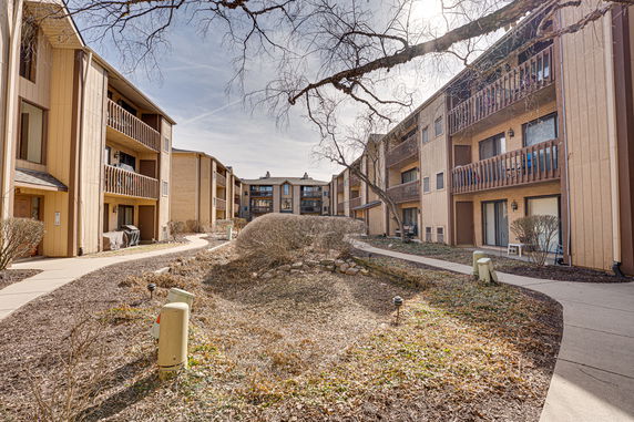 Front view of multi-story apartment buildings with balconies.