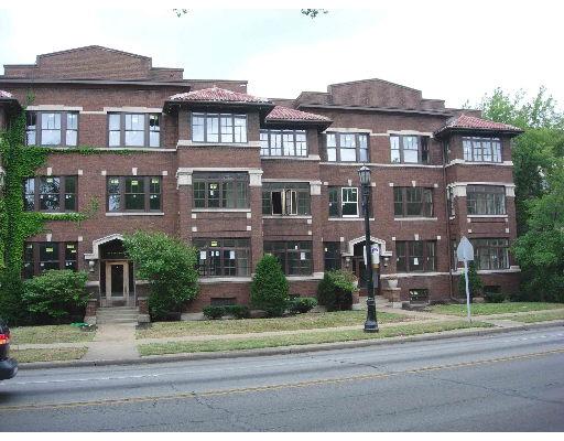 Front view of a multi-story brick building.