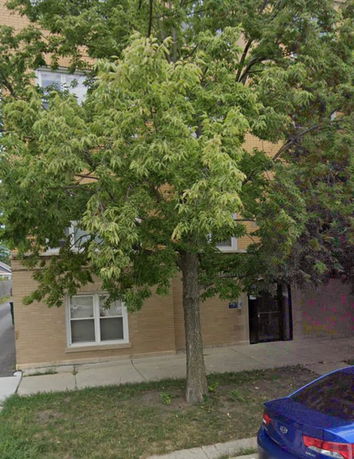 Front view of a multi-story brick building.