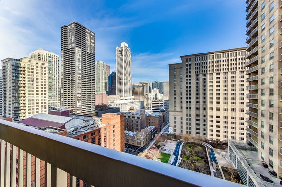 Panoramic view of a cityscape with multiple skyscrapers and buildings.