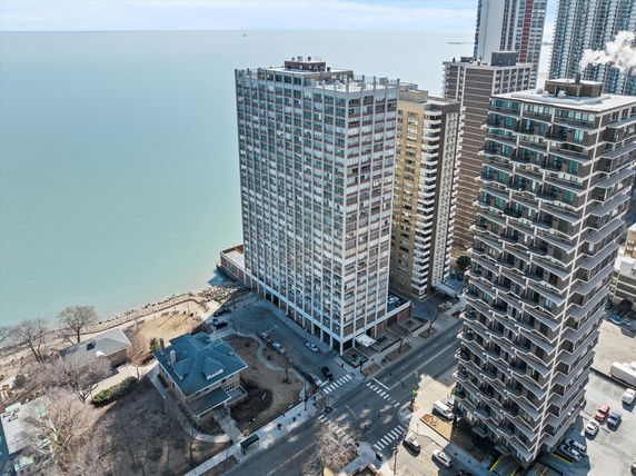 View of multi-story buildings near a waterfront.