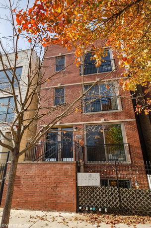 Front view of a multi-story brick building.