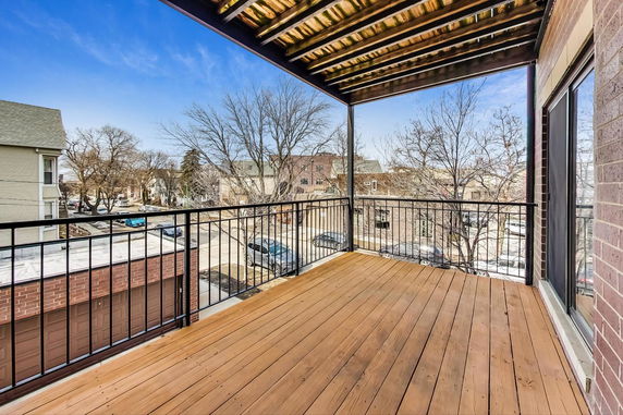 Wooden balcony view overlooking a residential neighborhood