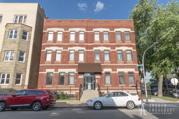 Front view of a three-story brick building.