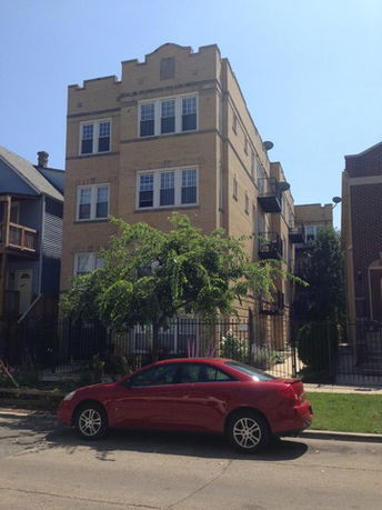 Front view of a multi-story brick building.