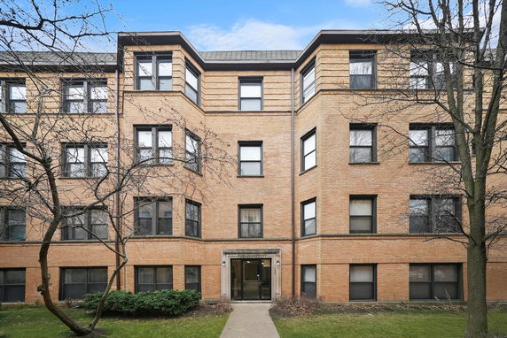 Front view of a multi-story brick apartment building