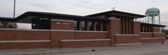 Front view of a brick building with a flat roof.