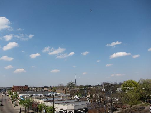Panoramic view of a town with buildings and a clear sky.