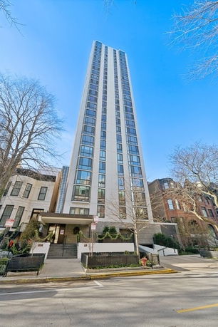 Front view of a tall, modern high-rise building.