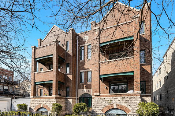 Front view of a multi-story brick building.