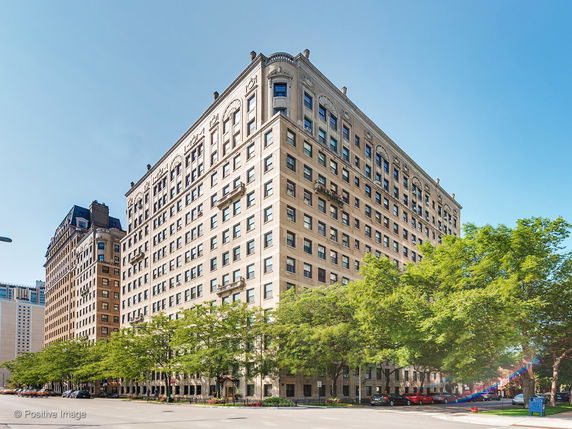 Front view of a multi-story building with a classic architectural design.