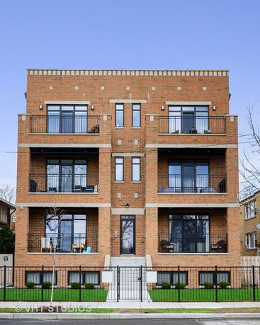 Front view of a multi-story brick apartment building