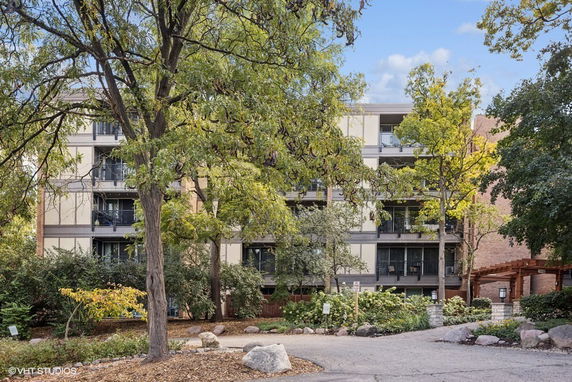 Front view of a multi-story residential building with balconies.