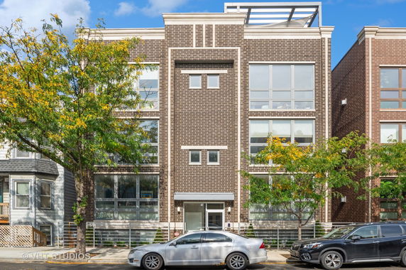 Front view of a multi-story brick building.