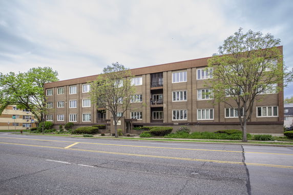 Front view of a multi-story apartment building.
