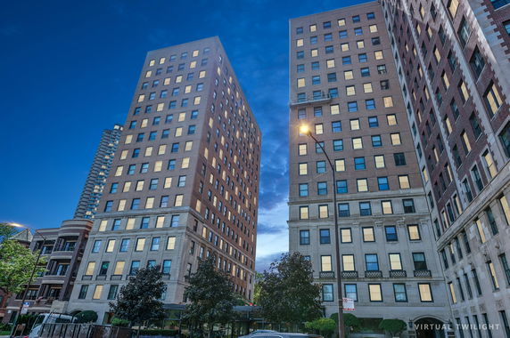 Front view of a high-rise building complex with multiple stories.