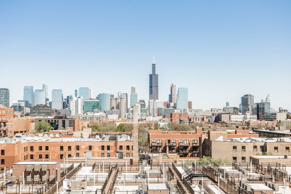 Panoramic view of a city skyline with various buildings and skyscrapers.
