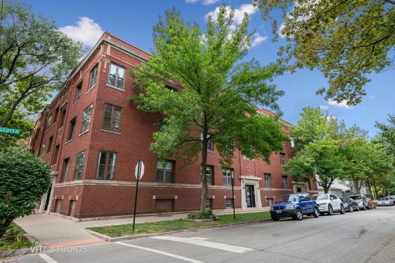 Front view of a multi-story brick building.