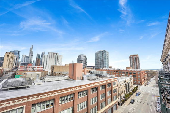 Panoramic view of urban skyline with buildings and clear sky.