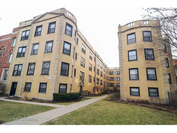 Front view of a multi-story brick residential building.