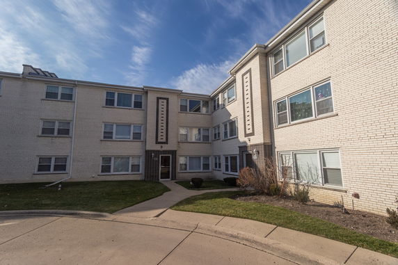 Front view of a three-story apartment building.