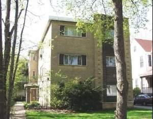 Front view of a multi-story brick building.