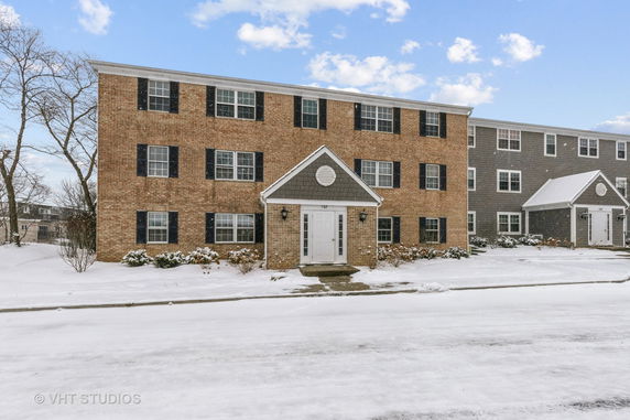 Front view of a three-story brick apartment building