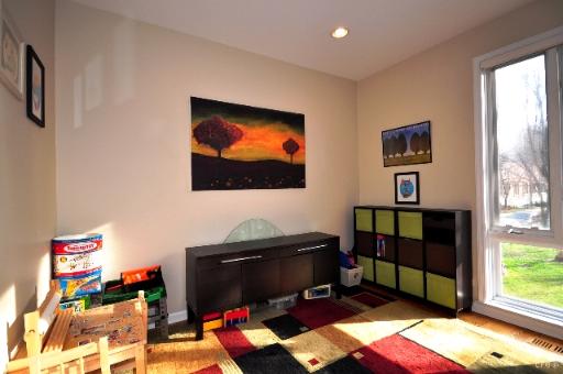 Room with children's toys and colorful storage cabinets.