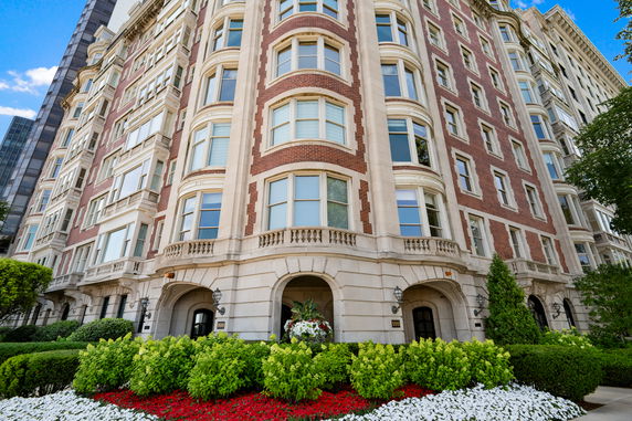 Front view of a multi-story building with brick and stone facade.
