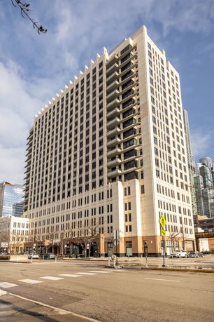 Front view of a multi-story building with a modern design.